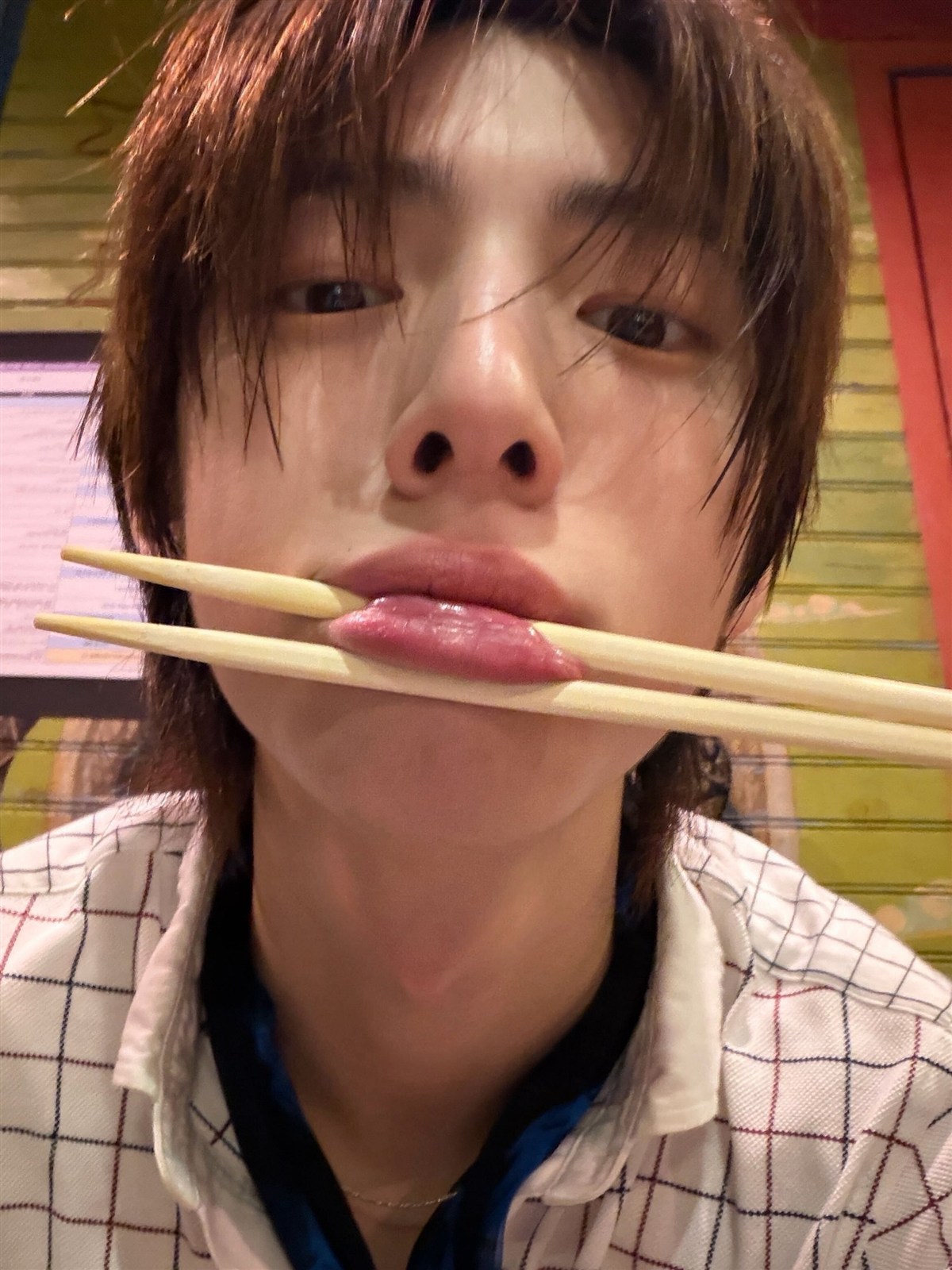 Amane holding chopsticks by his lips
