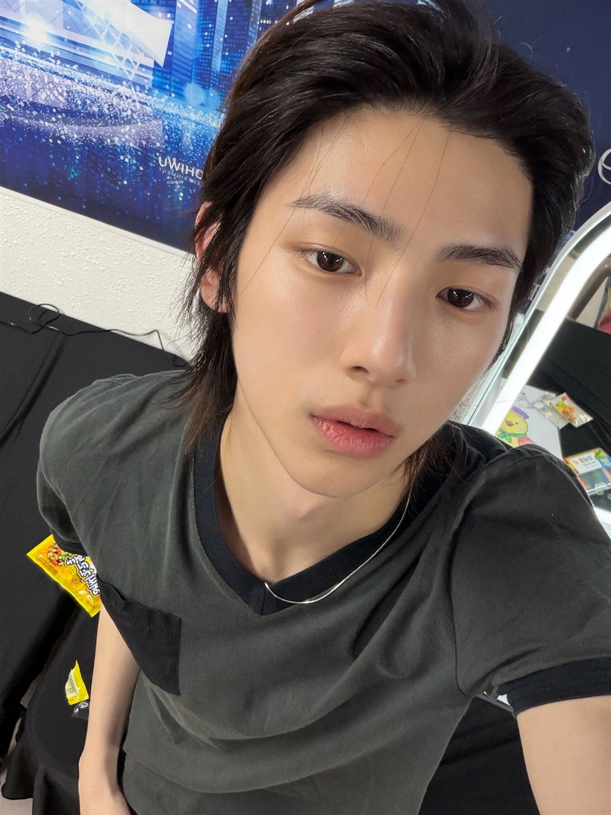 Amane taking a selfie in a dark shirt