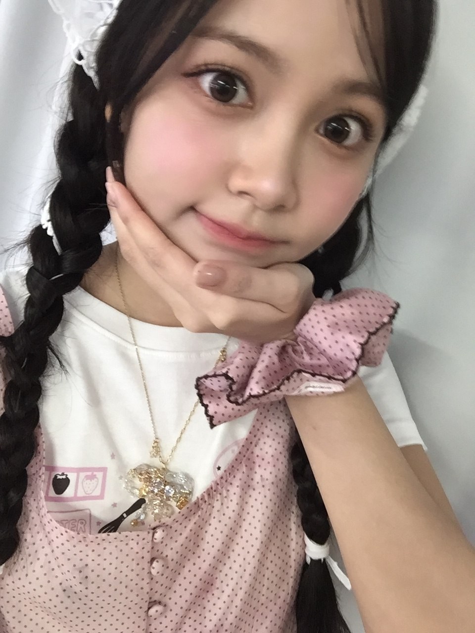 Cattia with braided hair and a pink outfit